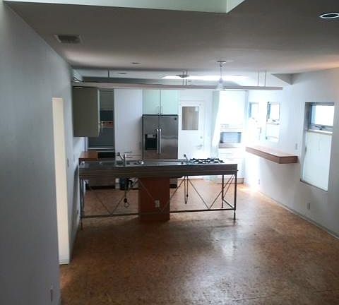Natural light at day's end from the great living/dining room looking into the kitchen.
