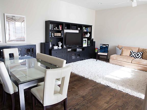 Stairs open to combined dining room/living room area