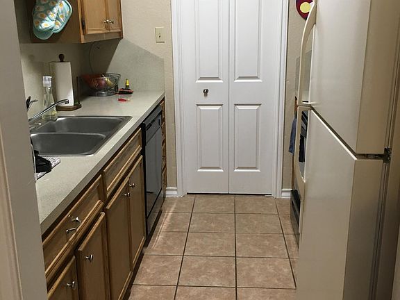Washer and dryer located behind bi-fold door