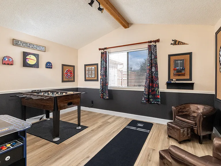 Game Room with Basketball game, mechanical dart board, Ms. Pac Man arcade game, board games, puzzles, and Foosball