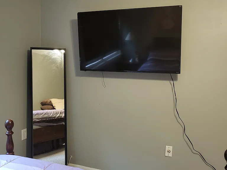 Full length mirror and 50" TV with Netflix and Amazon Prime included