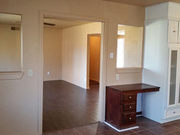 Kitchen also includes a desk.