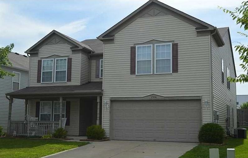 Exterior Front. Crisp 5 Bedroom Two Story. Easy care living & all the room you can dream of!