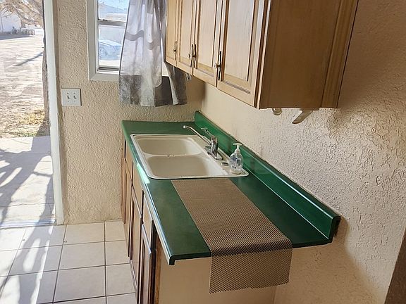 Kitchen cabinets/sink and front door
