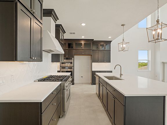 Kitchen with upper glass cabinets