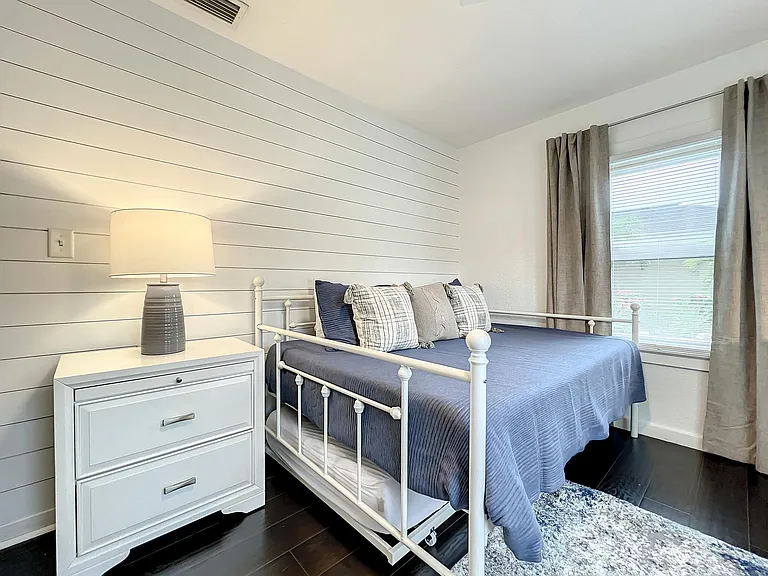 Front Bedroom/Office - blackout shades and sit/stand desk with monitor