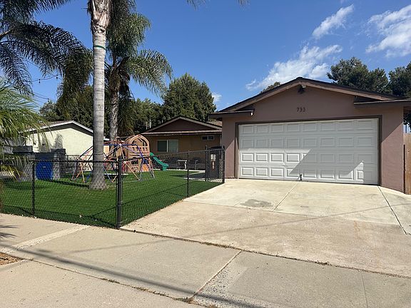 Driveway & Fenced Front Yard