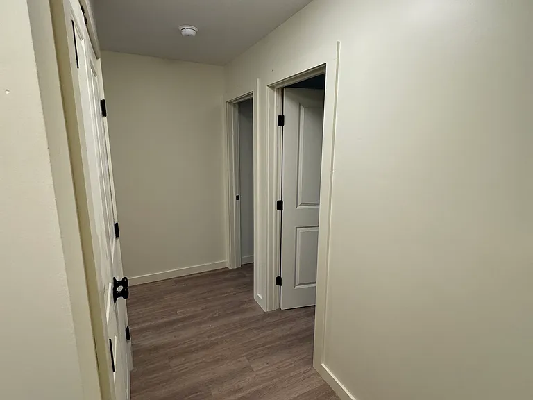 Upstairs hallway, closet to the left, and bedroom 1 and 2 to the right