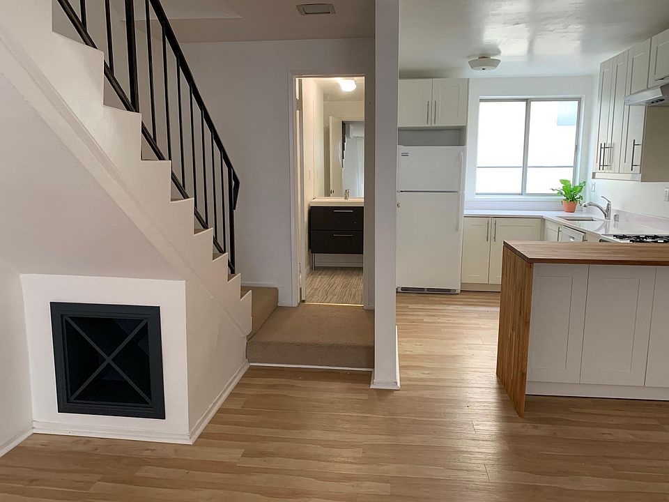 Lower level with living and dining space, kitchen, and guest bath