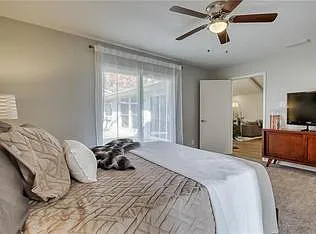 Largest bedroom with walk in closet, private bath and private entrance to back yard.