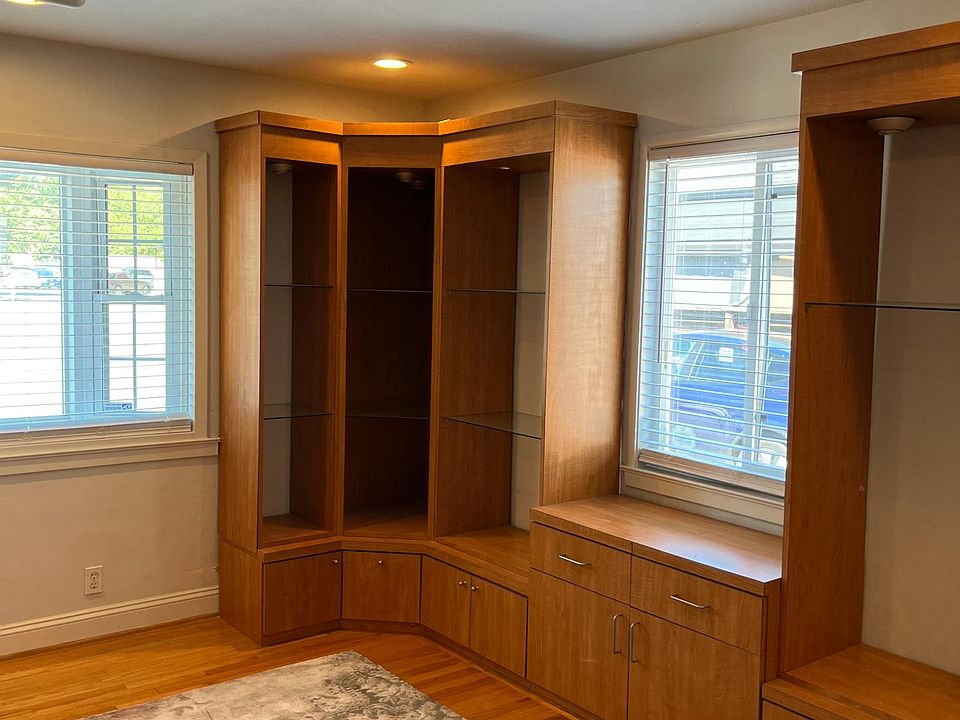 Bedroom with built in cabinets all around.