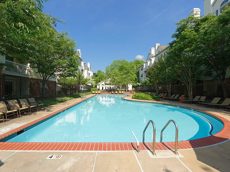 Swimming pool with sundeck and lounge seating