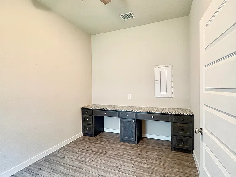 Laundry area & Study/Office/Craft Room Built-in desk & lighted ceiling fan.