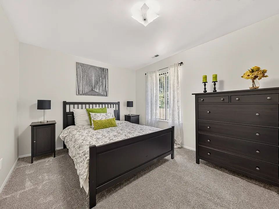 Modern bedroom with ample storage space at Eastwood Village Apartments in Clinton Township, MI.