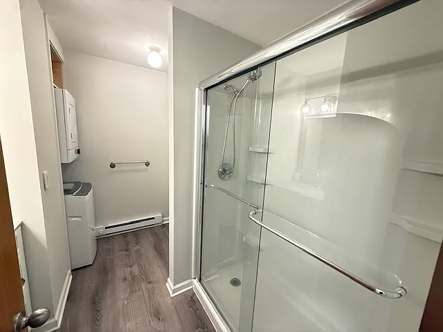 Remodeled full bath with washer and dryer.