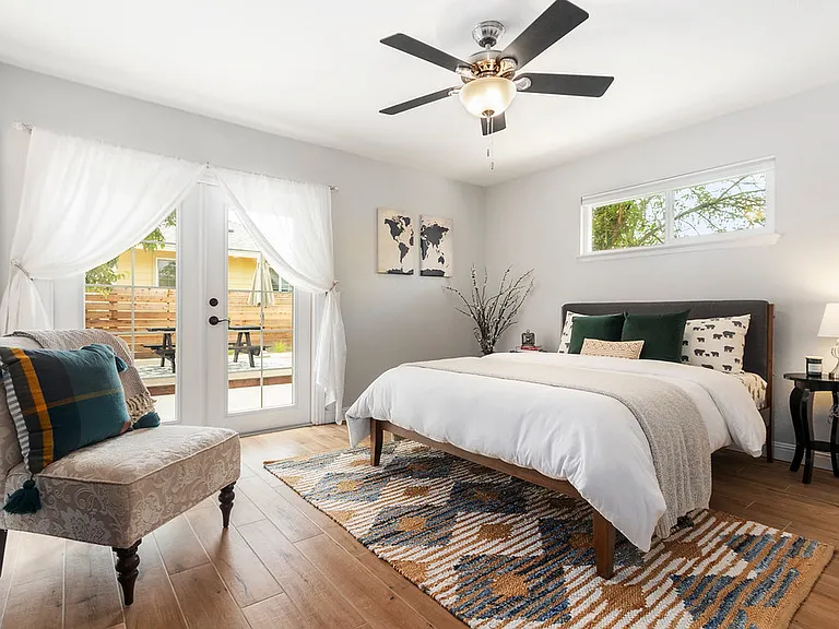 Primary Room with access to backyard and Queen Bed