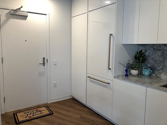 Front door, pantry and refrigerator