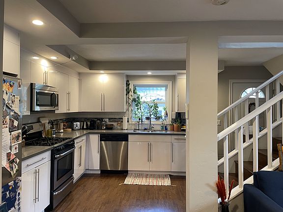Kitchen with window looking to shared outdoor dining