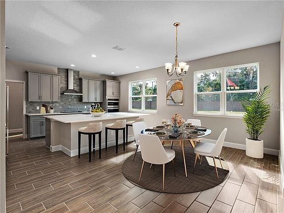 Virtually staged, photo is of a model and not the home to be built