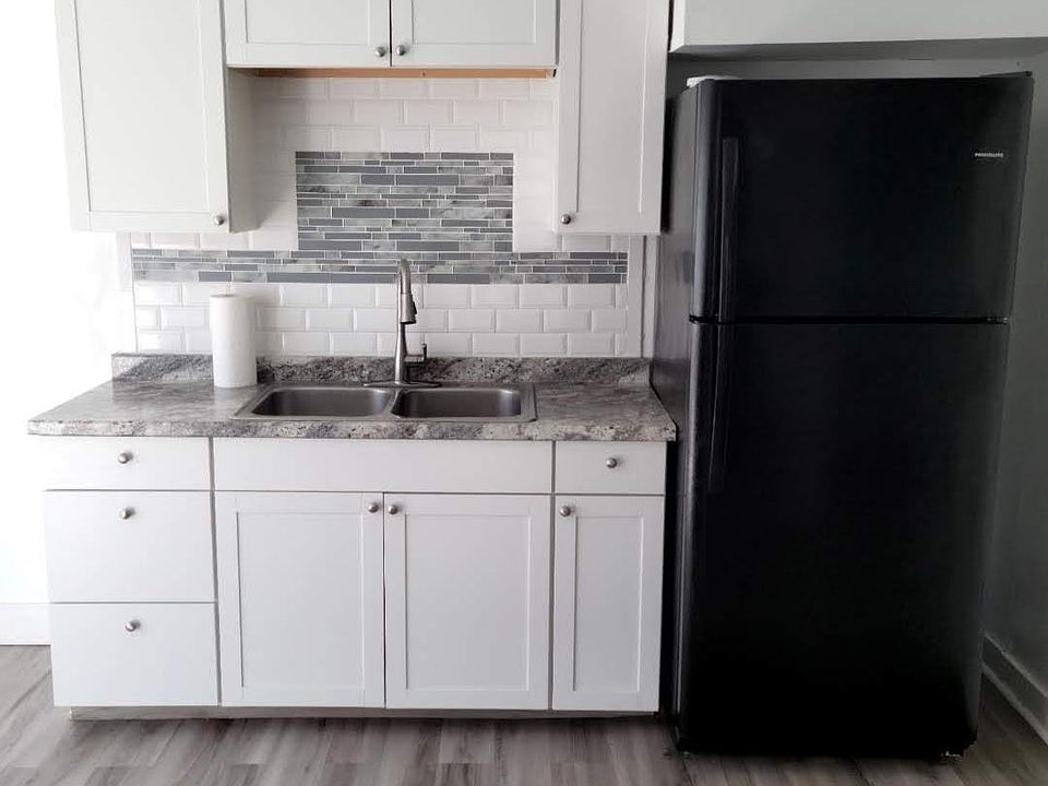 New Kitchen cabinets with double bowl SS Sink and Refrigerator