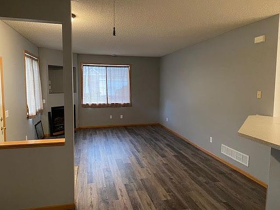 Main floor living-room with fireplace and new flooring.