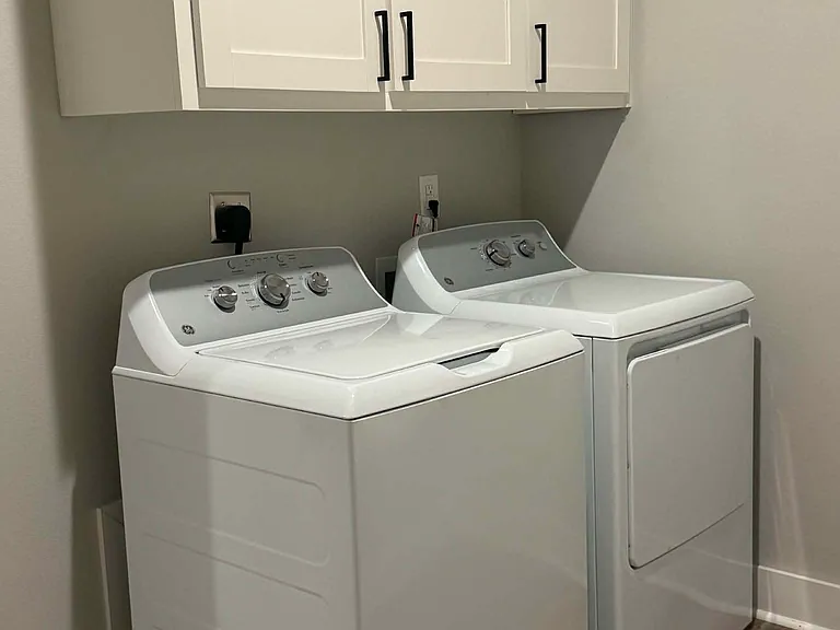 Brand new washer and dryer with above cabinet storage