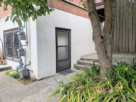 Front entrance to unit G, originally a caretaker's apartment.