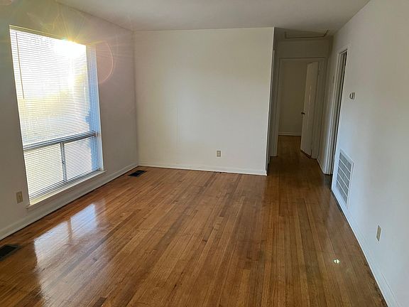Living room, bathroom on left, bedroom on right