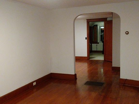 View towards dining room and kitchen from living room