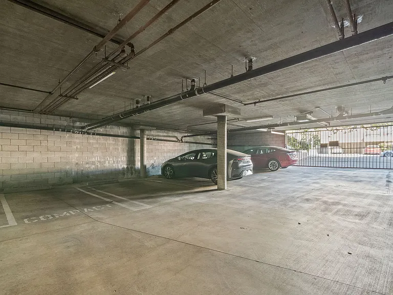 Two side-by-side parking spaces are included plus two guest parking spaces in a secure gated parking lot.