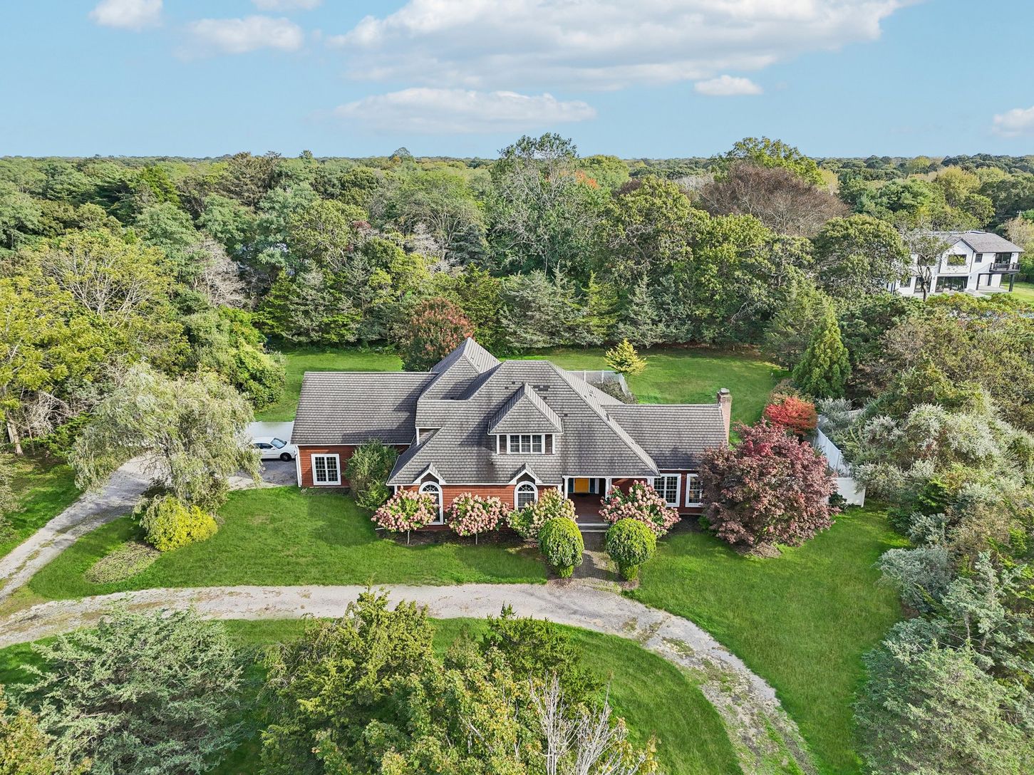 Stunning aerial perspective highlighting the property in natural daylight.