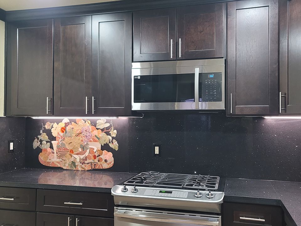 Brand new microwave and high-end stove with convection oven.