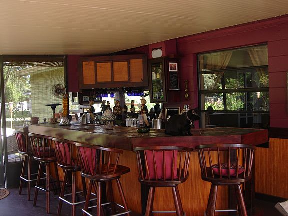 Screened bar area w/ 16' slate bar, sink and fridge, built in flat screen tv