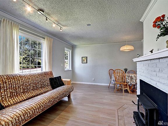 Living Room with EPA-approved fireplace.  Wood supply for fireplace behind the garage.