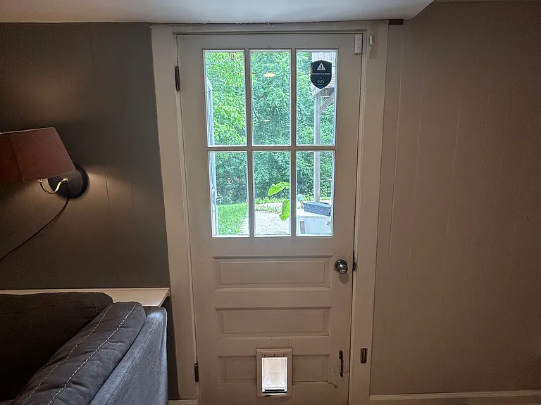 lower level door to backyard. Can be the private entrance to lower level "mother in law" apartment