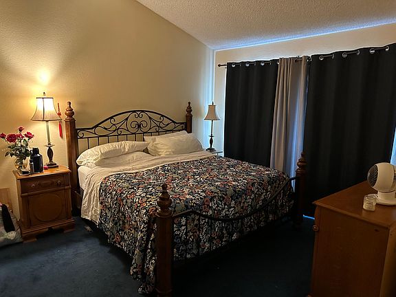 Master Bedroom Has a full closet and a patio.