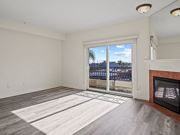 Large Living Room Space with Lots of Natural Light and a Private Balcony