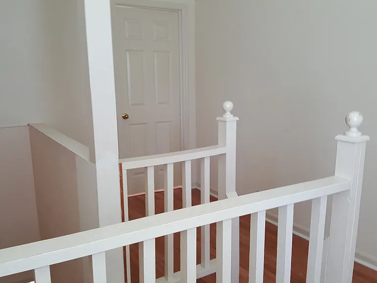Upstairs landing looking toward bedroom door