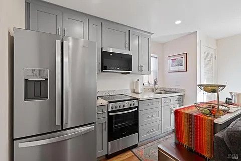 Modern kitchen with garbage disposal and north-facing window. (furniture not included)