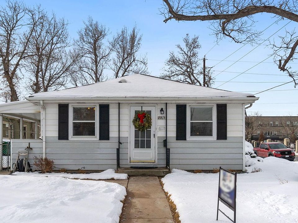 Lovely corner unit with picnic benches, side yard with BBQ, fenced in for dogs, and plenty of parking in the back of unit along with street parking.