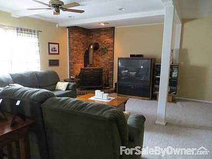 Gas Fireplace/Stove
						:
						Bright and cozy, this family room offers a Franklin Gas Stove insert.