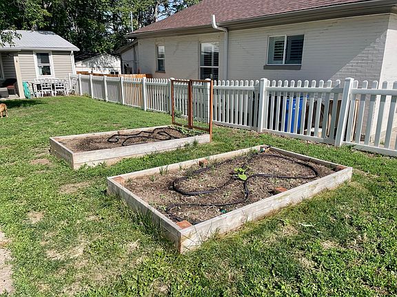 Raised garden beds with timed irrigation system