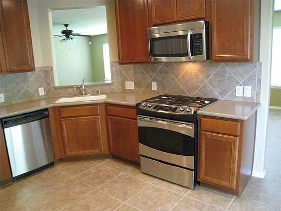 VIEW FROM THE KITCHEN INTO THE LIVING ROOM