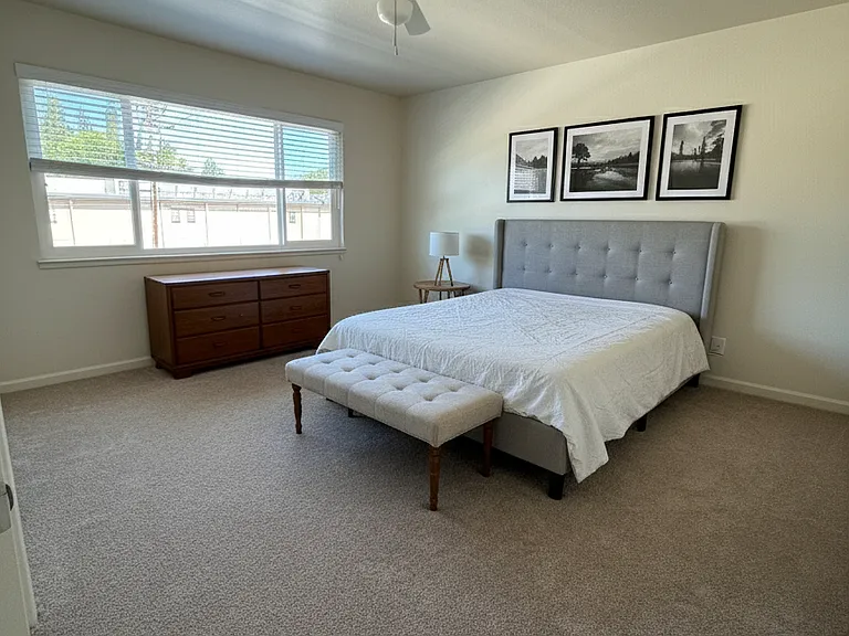 New carpet in the unfurnished bedroom -- but picture the bedroom with some furniture!