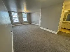 Spacious Living Room features large windows for natural light