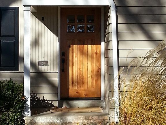 Paneled front door with leaded glass