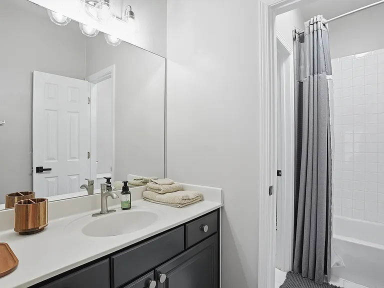 Shared Jack-and-Jill bathroom connecting two secondary bedrooms