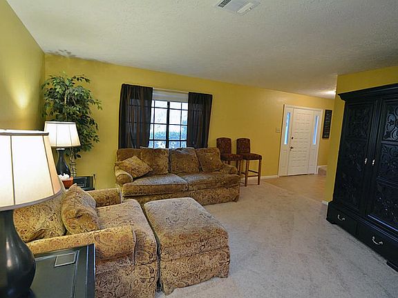 A view of the living room open to the foyer.