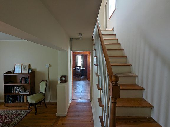 Stairs to upper floor with 2 bdrms and 1 bathroom.