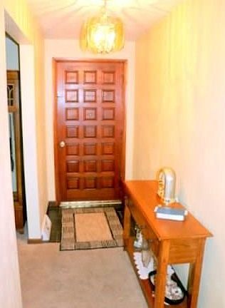 ENTRY FLOWS INTO THE FORMAL LIVING ROOM